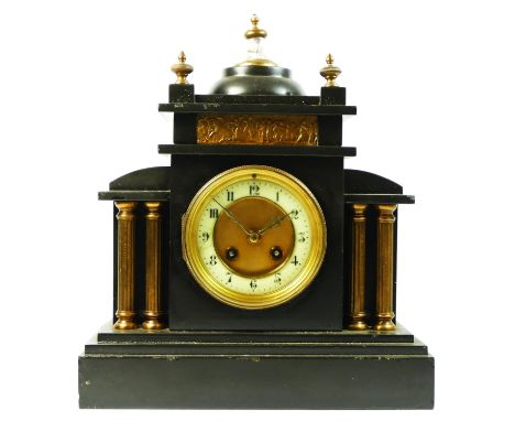 A Slate mantle clock c1890 with an 8 day movement striking the hours on gong, architectural style case with recessed reeded b