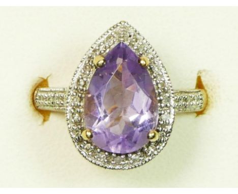 A 9ct gold, pear shape amethyst and diamond cluster ring, bordered by 20 stones, diamond set shoulders, M, 3.9gm 