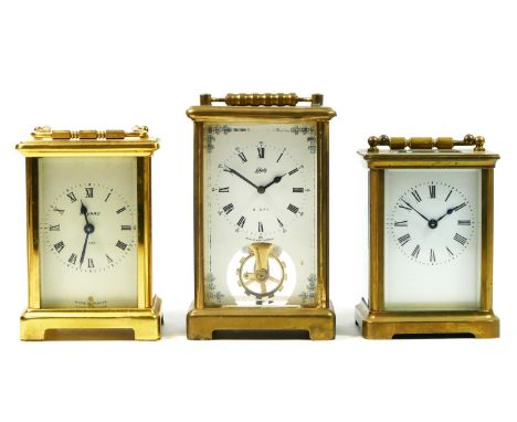 A French 8 day brass carriage clock, 12cm tall, together with a German Schatz 8 day carriage clock and a unnamed example. (3)