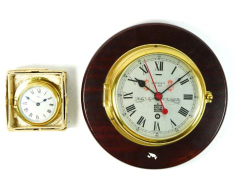 A brass bulkhead ships clock 'Admiralty', silvered dial, 8 day movement, mounted on a mahogany plaque, 18cm diameter (clock) 