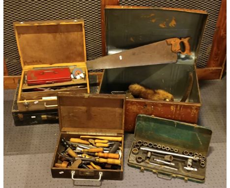 A large metal trunk and contents, to include carpenters hand tools in three tool chests. 