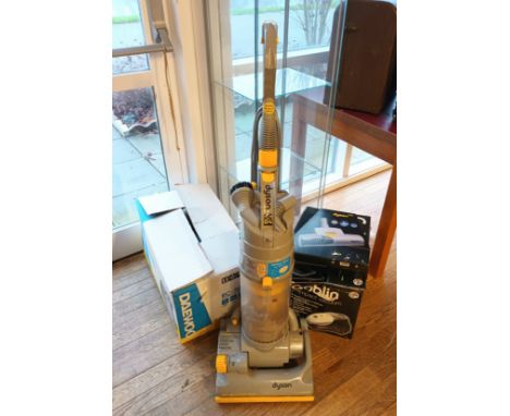 A Daewoo vacuum cleaner, RC-7004F, (boxed) together with a Goblin compact vacuum cleaner and a Dyson DC04 vacuum cleaner. (3)