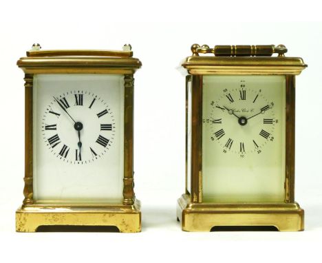 An English brass cased carriage clock by London Clock Co, enamelled dial with roman numerals, stamped 8 day movement, 12cm ta