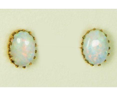 A pair of 9ct gold and opal earstuds, good colour play, 9 x 6mm, 1.3gm