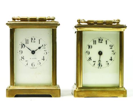 An early 20th century brass cased 8 day carriage clock, bevel edge glass panels, white enamelled dial with Arabic numerals, 1