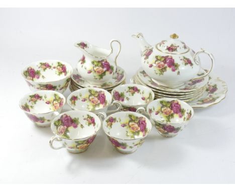 A Royal Chelsea 'Golden Rose' fine china tea service, comprising of six cups &amp; saucers, six side plates, a sandwich platt