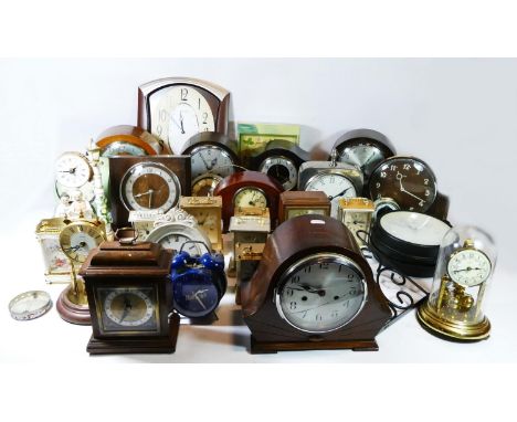 A collection of wall clocks, carriage clocks, anniversary clocks, having manual and quartz movements. 