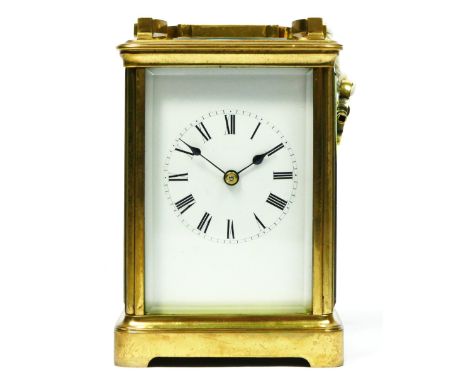 An early 20th century English brass striking carriage clock, white enamel dial, ABEC lever platform, the movement striking th