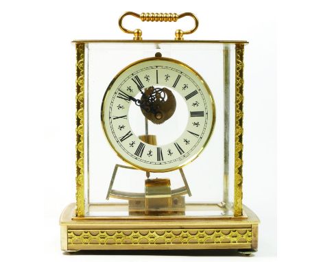 A West German brass and glass cased Skeleton clock with Kieninger and Obergfell electromagnetic movement. 23cm tall. 