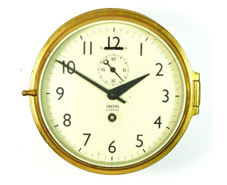 A Smiths Empire brass bulkhead ships clock, made in England, mechanical movement, 18cm diameter. 