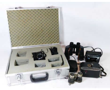 A 35mm Canon camera body AE-1 with hitachi case, together with two pairs of field binoculars; Zenith 7x50, an Agfa folding ca