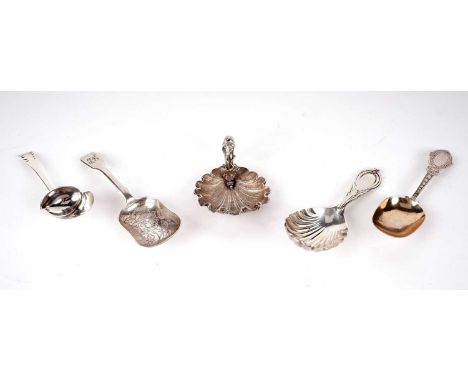 A Victorian silver Lily pattern caddy spoon, by George Unite, Birmingham 1871; three other Victorian silver caddy spoons; and