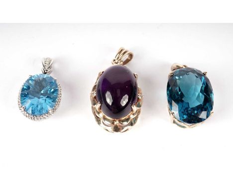 Three gold set pendants, one set with amethyst cabouchon in 14ct gold mount, two set with topazs in 9ct gold mounts, 22.1g gr