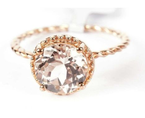 A champagne danburite ring, in 9ct gold mount, ring size R, with Gemporia card; and an amethyst ring, in 9ct white gold mount