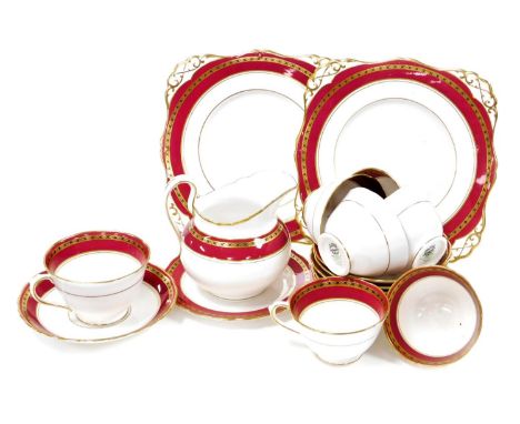 A Plant Tuscan china part tea service, in red and gilt made exclusive for Harrods of Knightsbridge, comprising six teacups, m