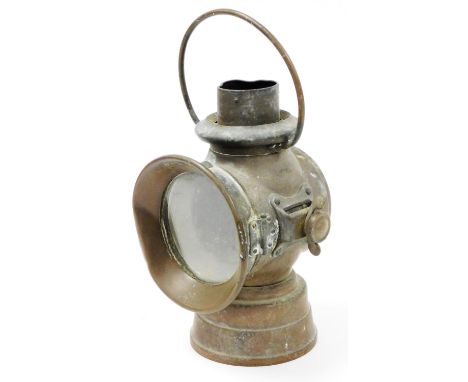 An early 20thC Lucas No.72 lamp, with circular glass, and swing handle on a circular foot, 30cm high.