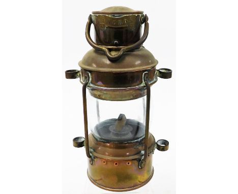 A paraffin miner's type lamp, with applied anchor scroll badge, 26cm high.N.B. This lot is sold on behalf of the Rotary Club 