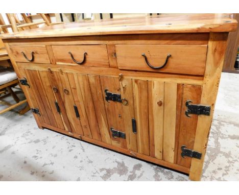 A hardwood sideboard, in the rustic style with button bordered top, three drawer top section and three cupboard base, 90cm hi