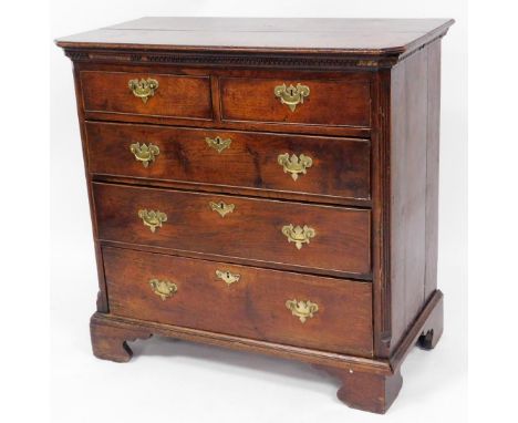 A George III mahogany chest, of two short and three long drawers, each with brass handles, with fret framed top, pillar sides