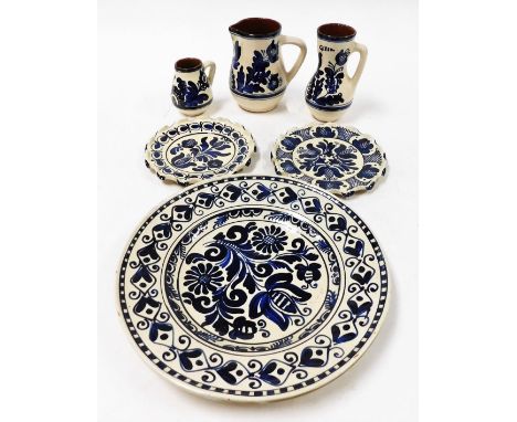 Various blue and white Delft type items, to include charger, two side plates, large and small jug, and a vase. (6)N.B. This l