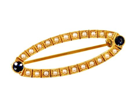 A sapphire and seed pearl set brooch, with single sapphire to each end and row of seed pearl to each side, in a yellow gold s