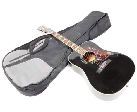 An Epiphone Hummingbird acoustic guitar, with six chrome plated tuning pegs, mother of pearl inset fret board and in black co