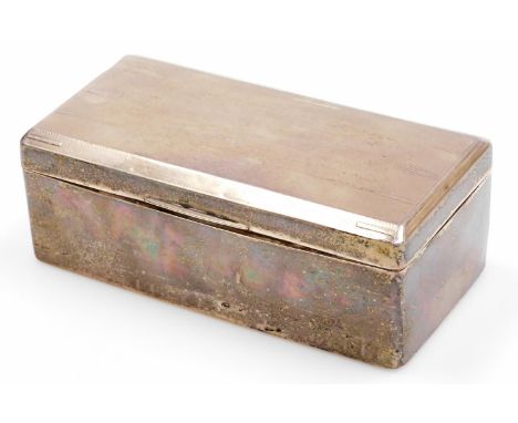 A George V Art Deco silver cigarette box, rectangular shaped, cedar lined with sectional interior, and a lined and arrow exte