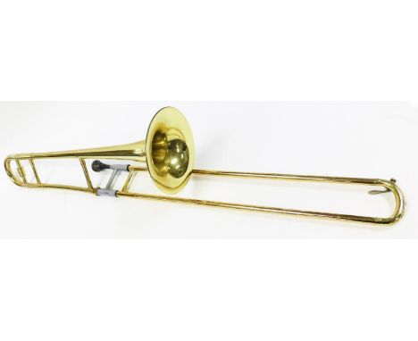 A Blessing Scholastic Elkhart Ind USA trombone, with mouthpiece, 114cm long, the horn 20cm wide.N.B. This lot is sold on beha