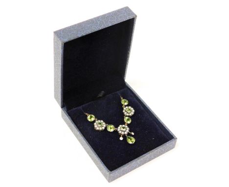 A diamond, seed pearl and peridot cluster necklace, the pendant section set with three clusters set with central square cut p