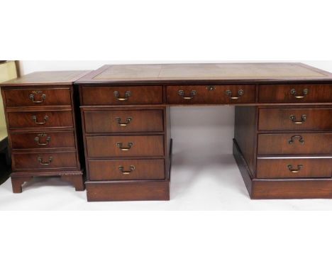 A 20thC mahogany twin pedestal desk, tooled leather top, raised above three frieze drawers and six pedestal drawers, on a pla