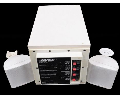A Bose Acoustimass 3 series II speaker system, main body 20cm high, with further Bose speakers.