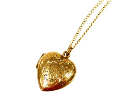 A 9ct gold pendant and chain, the 9ct gold heart shaped locket pendant florally engraved, on a fine link chain, 5.1g all in. 