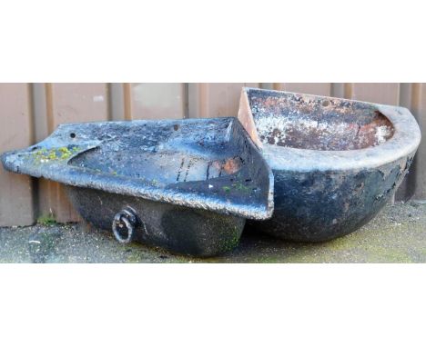 An iron corner planter, with shaped pierced centre, 83cm wide, and a further corner planter. (2)