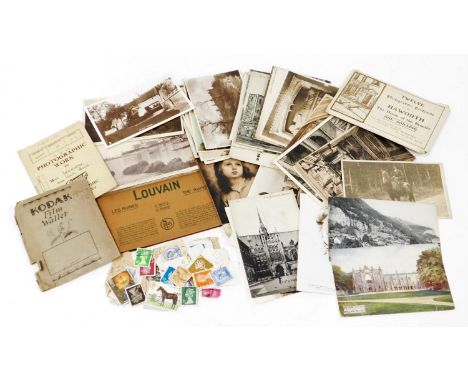A small group of black and white postcards and stamps, comprising Dartmoor, Catacombe, Oxford, various architectural scenes, 