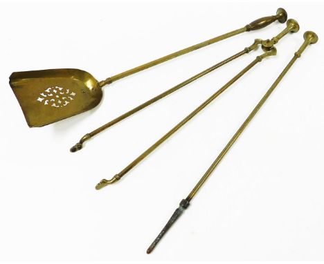A set of brass fire implements, with plain stem and bobbin finial handles, comprising poker, tongs, and shovel. (3)N.B. This 