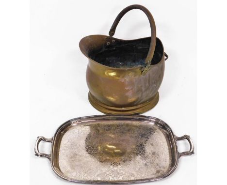 A copper coal helmet, and a silver plated serving tray. (2)