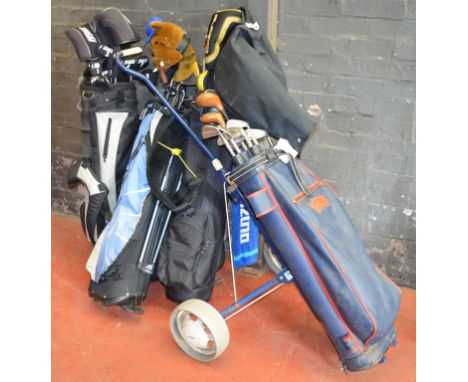 POLICE > 4 golf bags containing a good quantitty of golf clubs and accessories. [NO RESERVE] [VAT ON HAMMER PRICE]