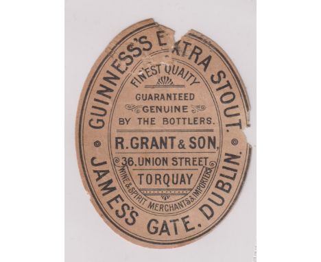 Beer label, Guinness's Extra Stout, a rare c1896 vertical oval bottled by R Grant &amp; Son, Torquay, 85mm high (some paper l