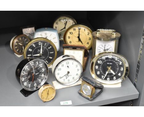 A mid-century 'Smiths' travel clock in original brown leather case, w8cm, sold together with a Big Ben alarm clock, a carriag