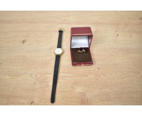 A lady's gold plated Montine wrist watch having baton numeral dial to champagne face in circular gold plated case with black 
