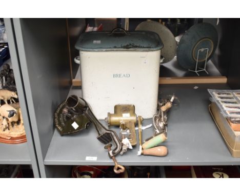 A vintage enamelled bread bin with cover, h31cm, sold together with a marmalade cutter, an egg beater and mincer, ( 4 )