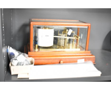 An early 20th century mahogany cased barograph with gilt brass mechanism and clockwork recording drum, detailed W.T. Story, L
