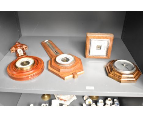 An early 20th century oak barometer having temperature gauge, L45cm, sold together with 3 other barometers, ( 4 )