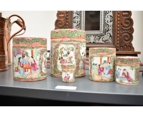 A group of 5 Chinese Canton Famille Rose porcelain jars with covers, hand painted with floral patterns and traditional figure