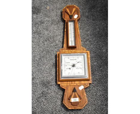 An Art Deco style mahogany barometer, having thermometer scale, h62cm  Condition report: Damage to glass