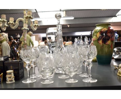 A group of crystal cut glass ware comprising of six wine glasses, siz port glasses and a decanter with stopper, h37cm
