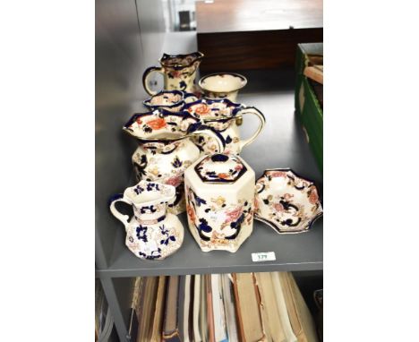 A Mason's ironstone 'Mandalay' pattern pitcher, decorated with floral patterns on a cream ground, sold together with a vase, 