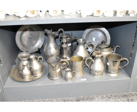 A quantity of pewter tankards of various sizes, largest h13cm, sold together with a candlestick, ewer and 2 plates ( 16)
