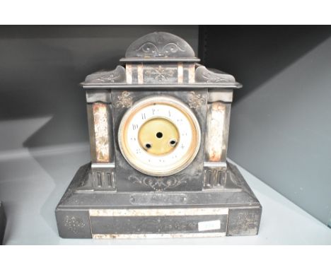 A 19th century black slate Quartz mantel clock having enable dial and Roman numerals, h31.5cm  Condition report: No movement 