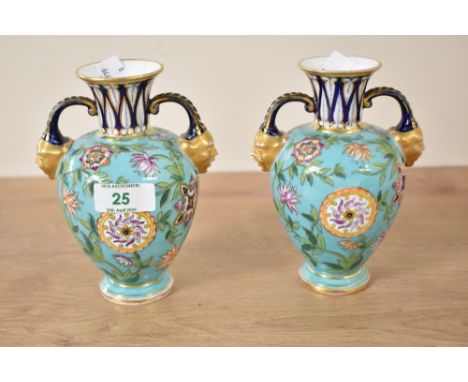 A pair of Crown Derby urn vases having gilded twin mask handles, decorated with floral patterns on a turquoise ground, makers